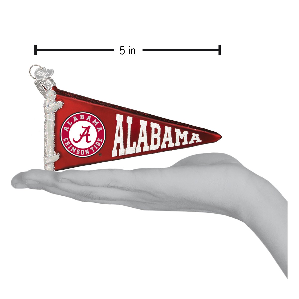 5-inch red glass Alabama Crimson Tide pennant ornament with white logo and lettering held in a hand.