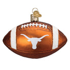 Burnt orange glass football ornament featuring a white Texas Longhorns logo and glittery white stripes.