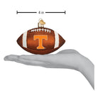 4-inch brown glass football ornament featuring the Tennessee Volunteers orange T logo and glittery white stripes.