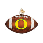 Brown glass football ornament featuring the yellow and green Oregon Ducks O logo with white glitter laces and stripes.