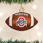 Brown glass football ornament featuring the Ohio State University logo, white glitter accents, and a gold hanging loop.