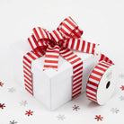 Red and white peppermint striped wired edge ribbon tied on gift box