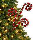 Red sequin curly spray decorating a Christmas tree branch