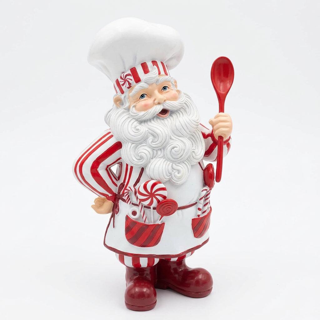 Three-quarter view of striped resin Peppermint Santa chef displaying lollipop-filled apron pockets