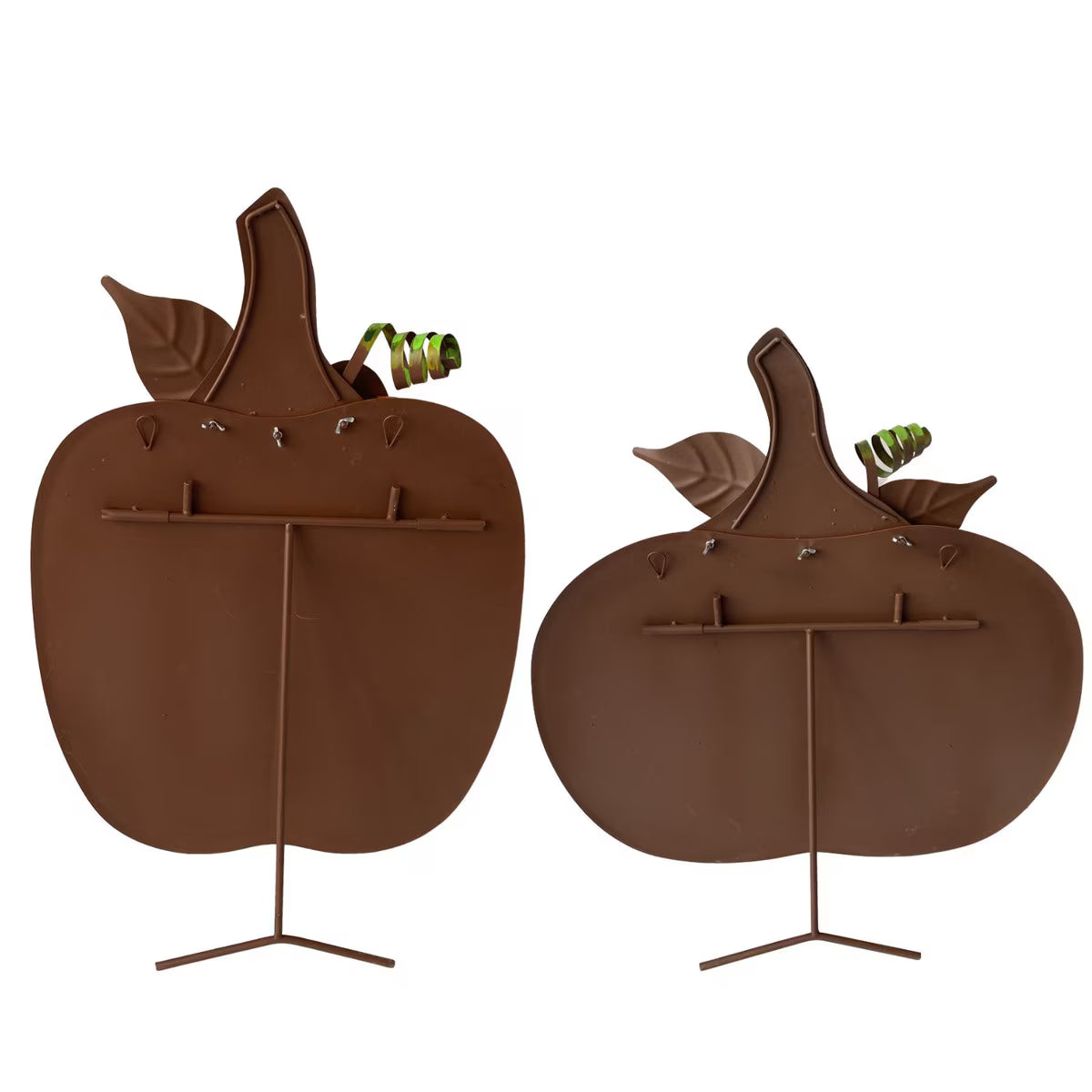 Back view of two orange metal ribbon pumpkins with attached easel stands for tabletop display.