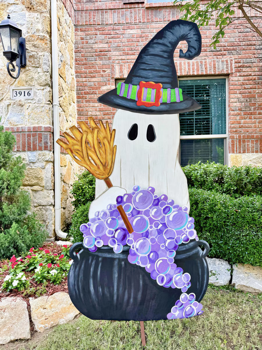 85-inch tall metal ghost witch yard decoration with a broom and purple bubbling cauldron for Halloween.