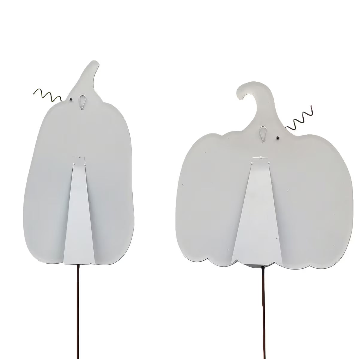 Back view of two decorative metal pumpkins with easel stands, hanging loops, and stakes for fall yard decor.