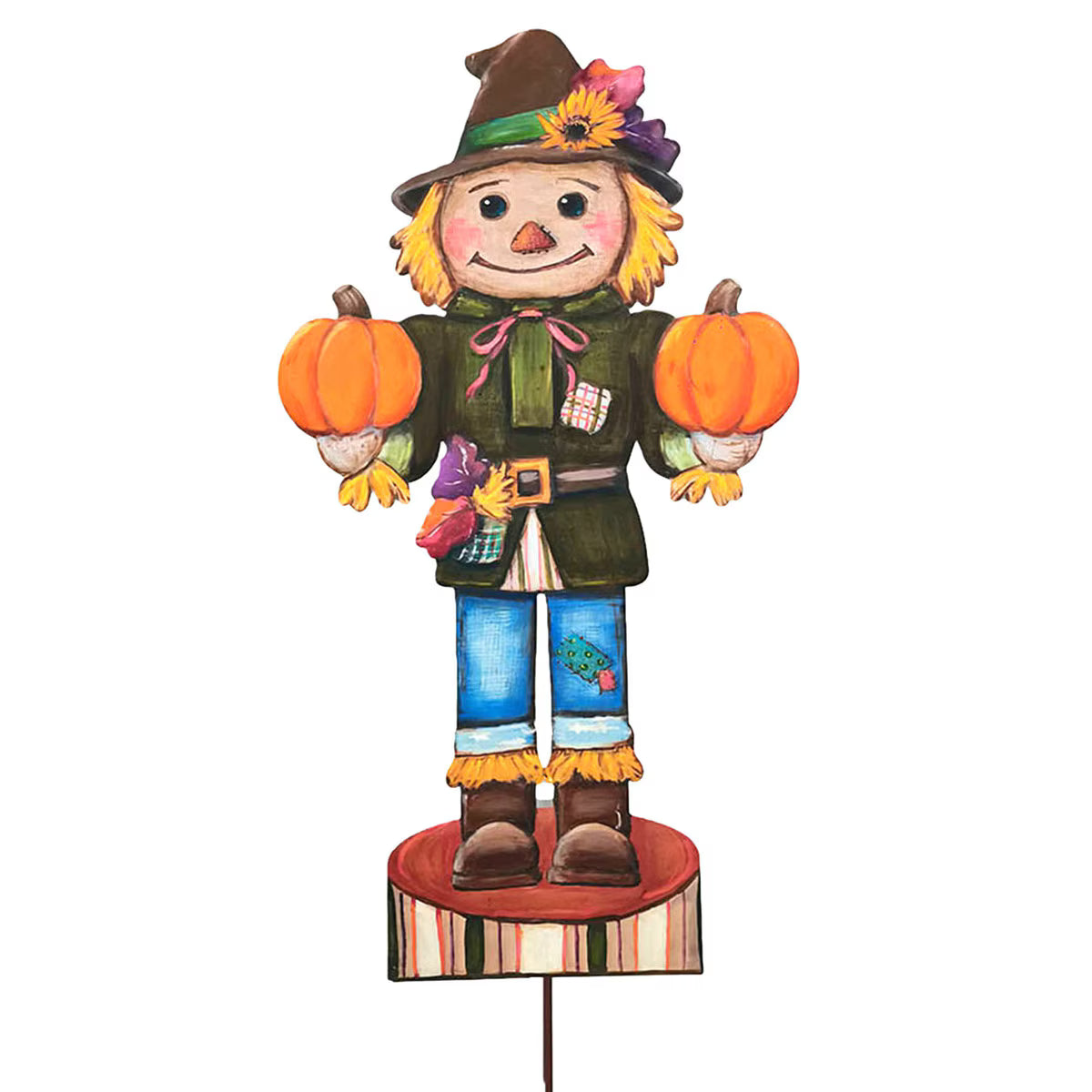 Whimsical 35-inch scarecrow nutcracker holding two orange pumpkins, featuring rustic autumn colors and a garden stake base.