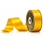 McGinley golden yellow satin ribbon roll with unspooled wave