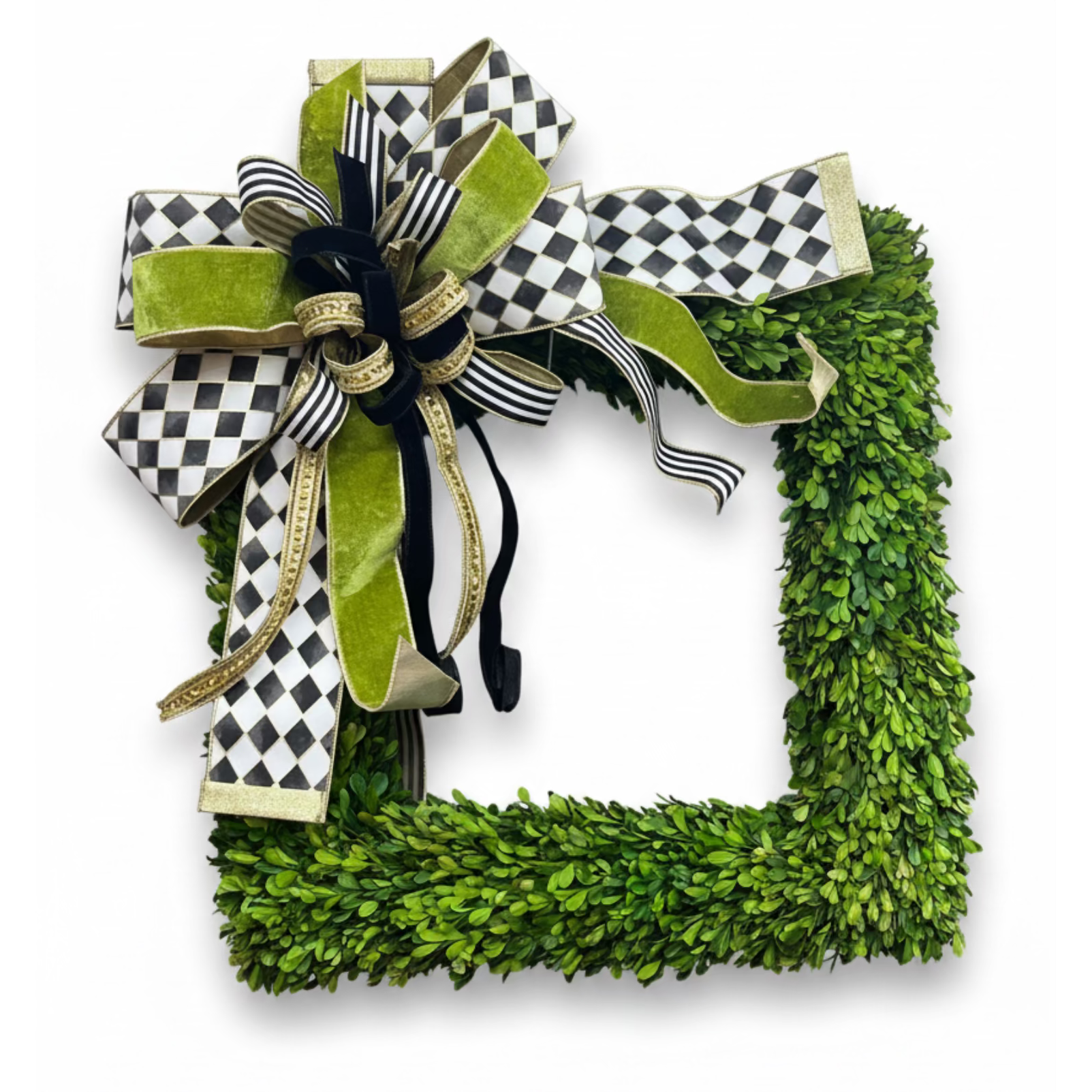 Large designer bow in black, white, and gold featuring checkered and velvet ribbons attached to a square boxwood wreath.