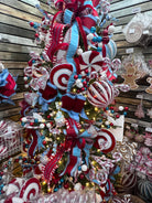Red, white, and ice blue peppermint ornaments on Christmas tree