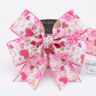 Close-up of pink floral and glitter heart pattern on wired edge ribbon