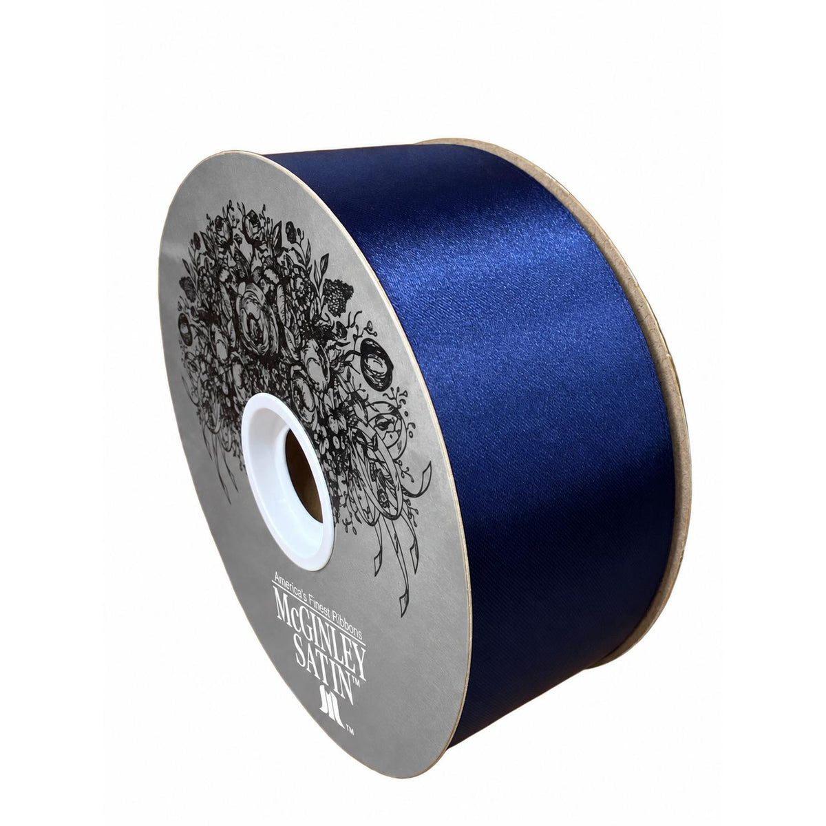 Close-up of navy blue satin ribbon spool with floral printed label