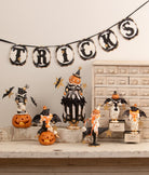 Bethany Lowe vintage-style Halloween display featuring a pumpkinhead figure riding a crow with glittered star accents.