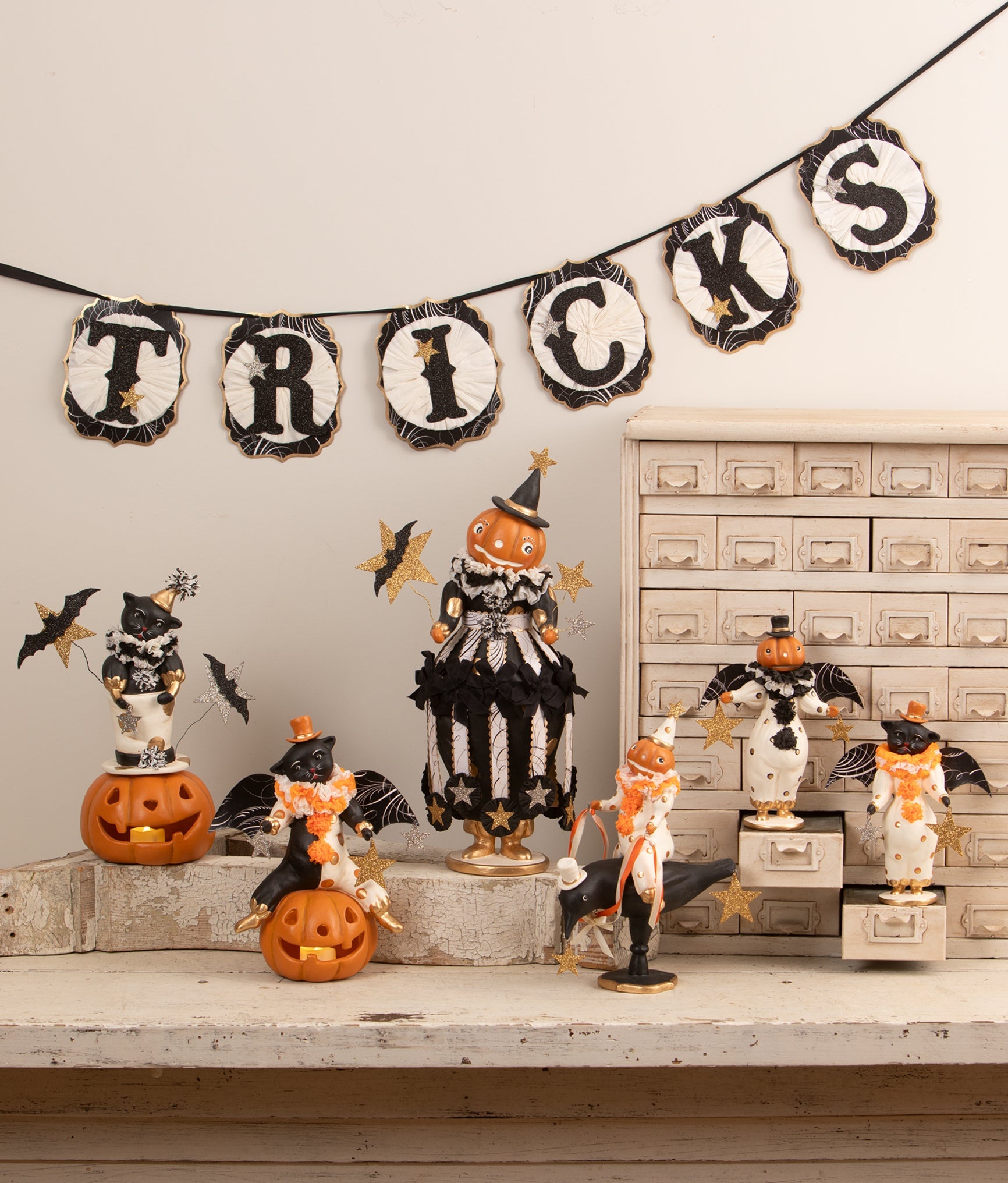 Bethany Lowe vintage-style Halloween display featuring a pumpkinhead figure riding a crow with glittered star accents.