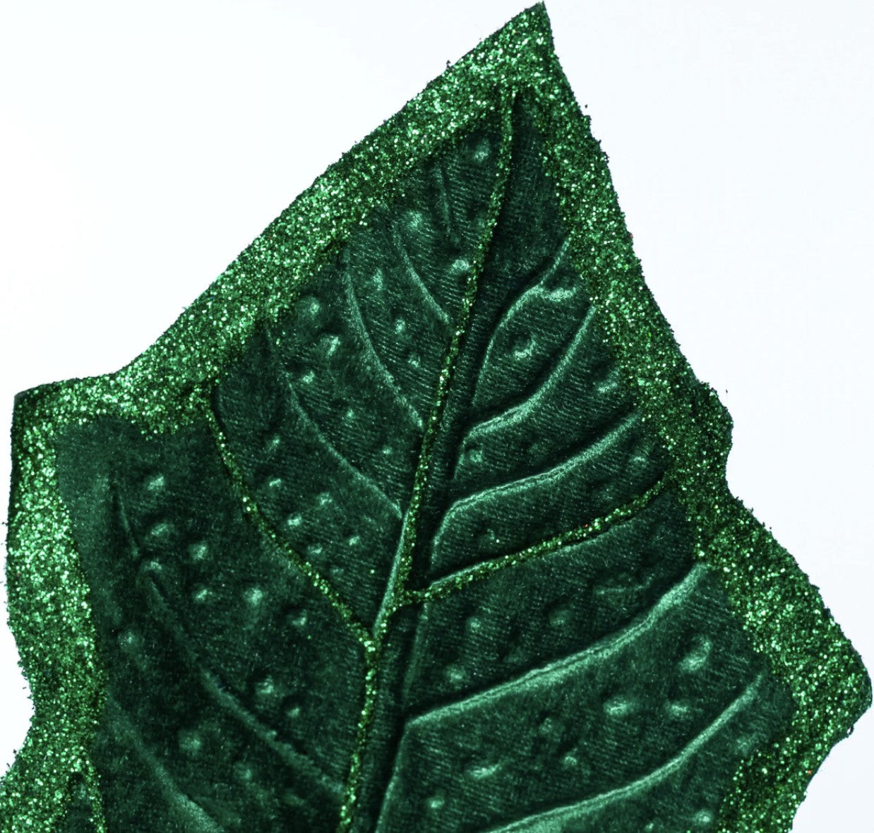 Emerald green fabric holly leaf with detailed veins, velvet texture, and sparkling glitter edges.