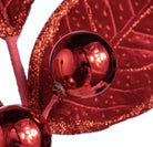 Red velvet holly spray with glitter-edged fabric leaves and two shiny metallic red berries on wired stems.