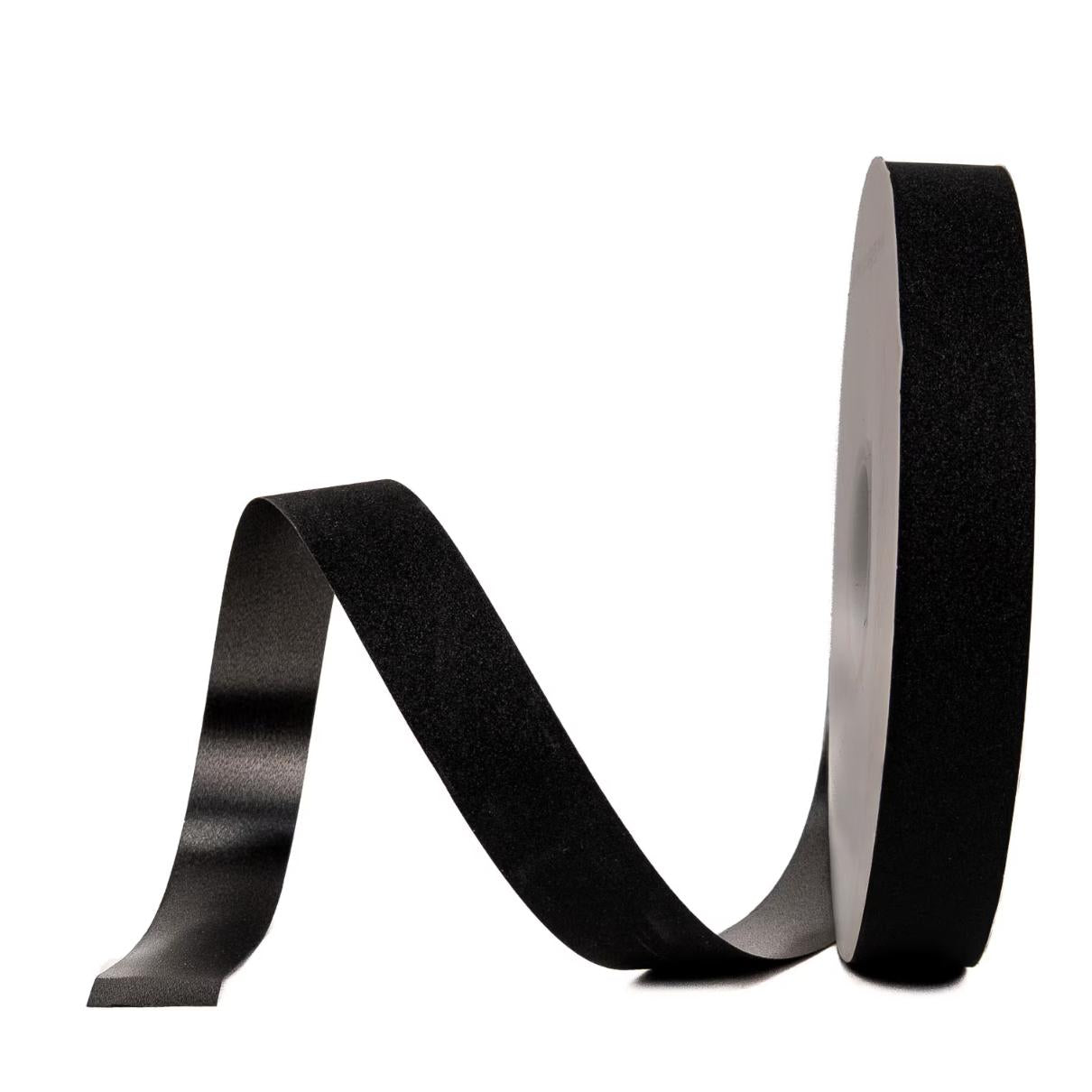Unspooling black glitter #5 ribbon for DIY homecoming decorations