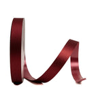 Side view of red non-wired glitter ribbon spool