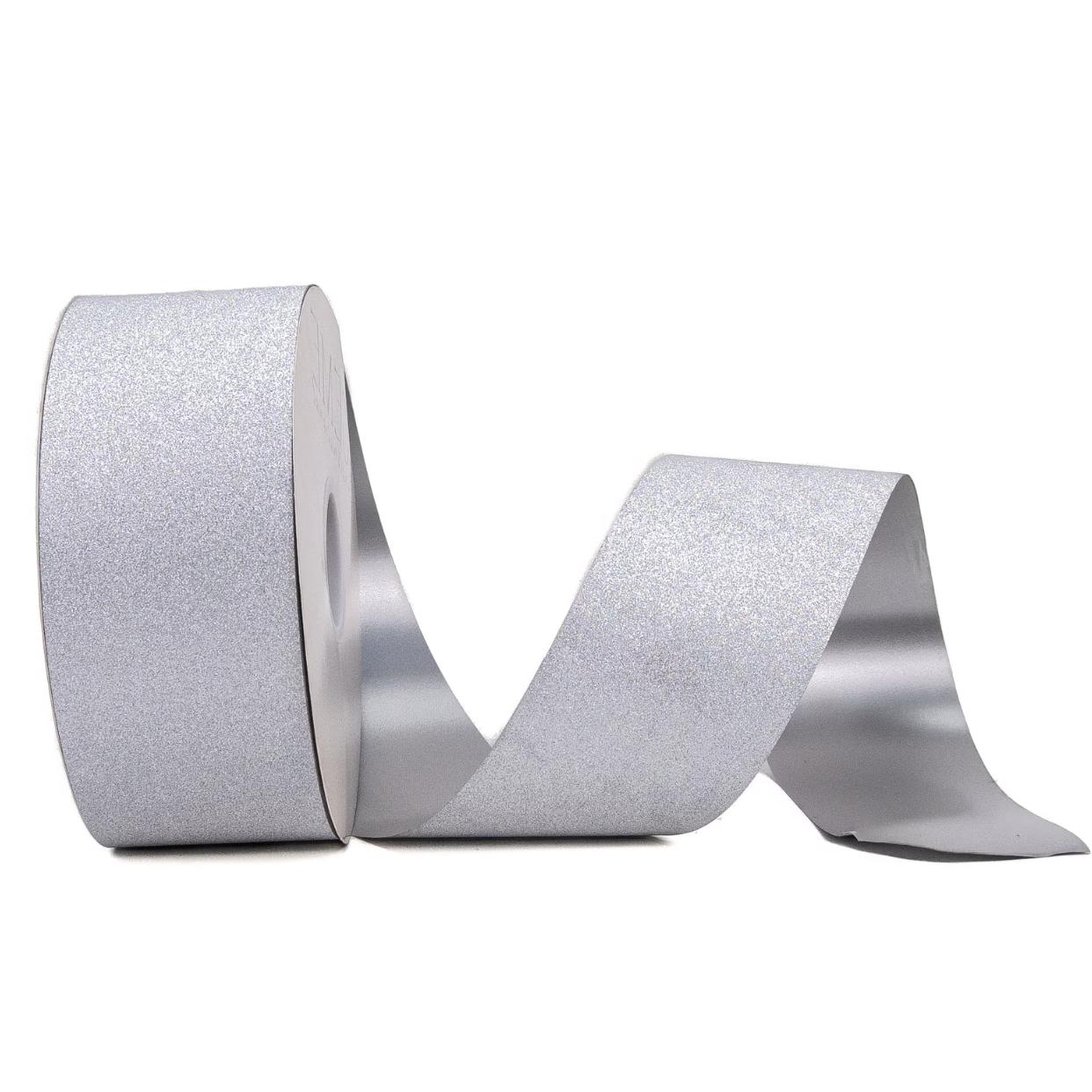 Upright roll of flexible silver glitter homecoming ribbon