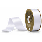 White satin ribbon roll with curled end and branded gold label