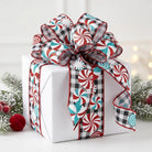 Black and white gingham wired ribbon with red and turquoise peppermint swirls tied in a bow on a gift box