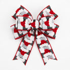 Decorative bow made from black and white check Santa hat ribbon