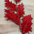 Shop For 28" Tinsel Holly Leaf Spray: Red