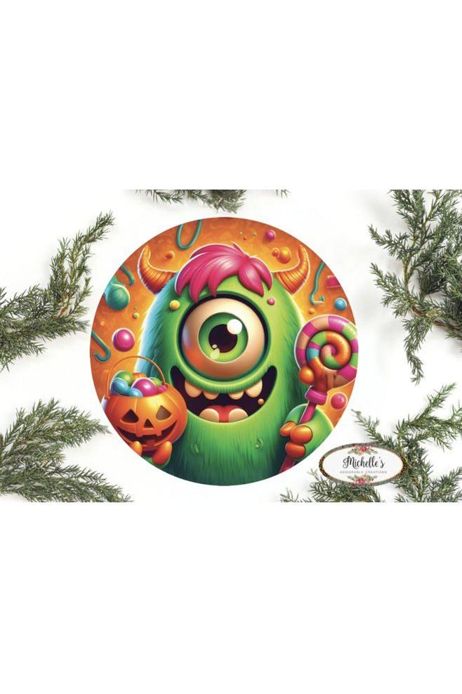 Shop For One Eyed Green Candy Halloween Monster Round Sign at Michelle's aDOORable Creations