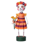 Lori Mitchell Freida Day of the Dead figurine in a striped dress with a floral headpiece and bouquet, 7.5 inches tall.