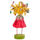 Lori Mitchell 6.5-inch resin figurine of a girl with curly blonde hair decorated with Christmas ornaments and gifts.