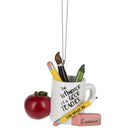 Resin teacher ornament featuring a mug with school supplies, a red apple, and a pencil eraser, 3.375 inches tall.