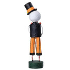 Lori Mitchell 8-inch skeleton figurine wearing a top hat, bow tie, and orange striped pants for Day of the Dead.