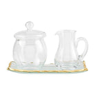 Clear glass cream and sugar set on a matching tray, featuring elegant hand-painted gold edges.