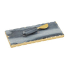 Gray marble serving board with gold foil raw edge and matching marble-handled brass spreader.