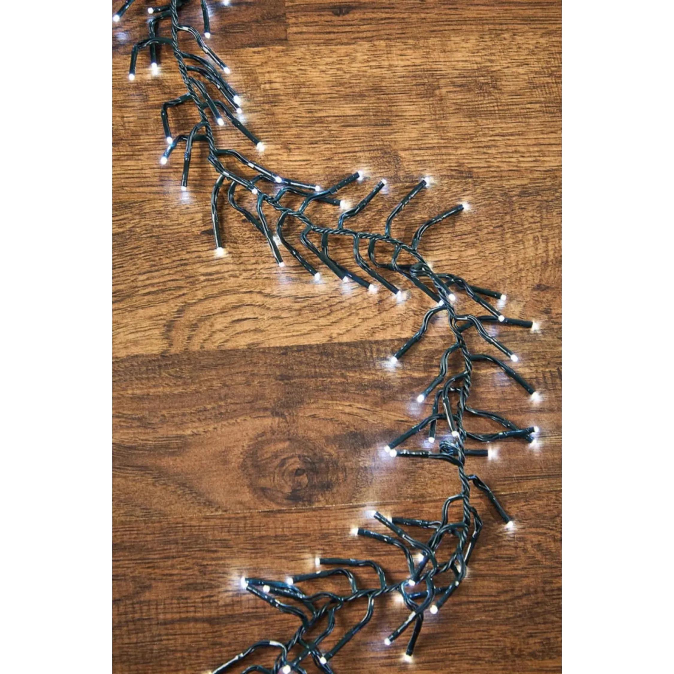 53' warm white twinkle cluster Christmas lights on dark green cord