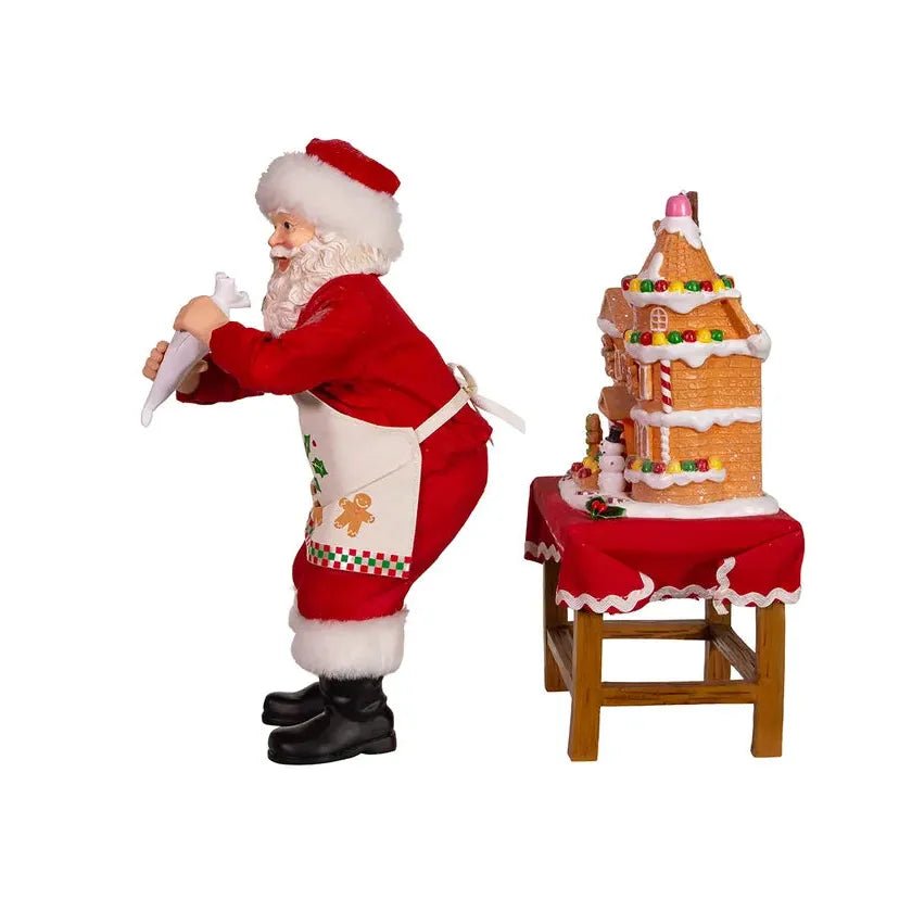 Shop For Kurt Adler 10.5" Fabriche Santa Decorating LED Gingerbread House Table Piece at Michelle's aDOORable Creations