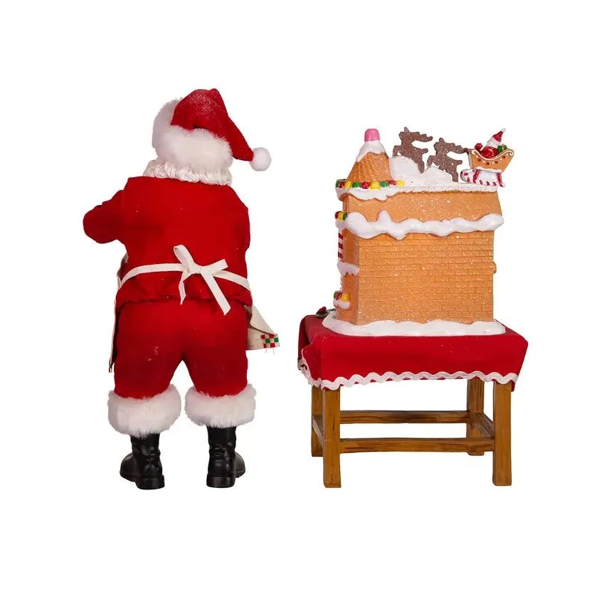 Shop For Kurt Adler 10.5" Fabriche Santa Decorating LED Gingerbread House Table Piece at Michelle's aDOORable Creations