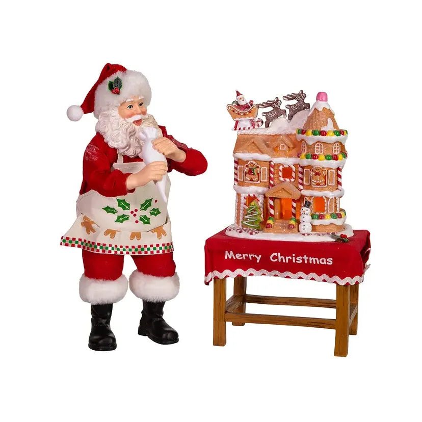 Shop For Kurt Adler 10.5" Fabriche Santa Decorating LED Gingerbread House Table Piece at Michelle's aDOORable Creations
