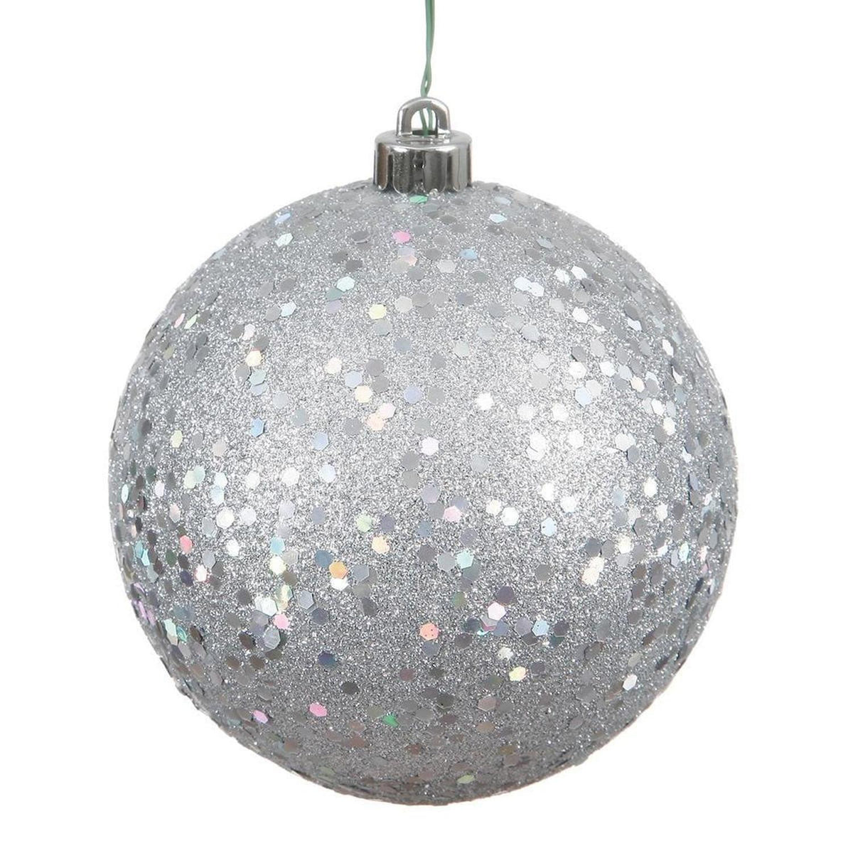 Close-up of shimmering hexagonal sequins on silver holiday tree bauble